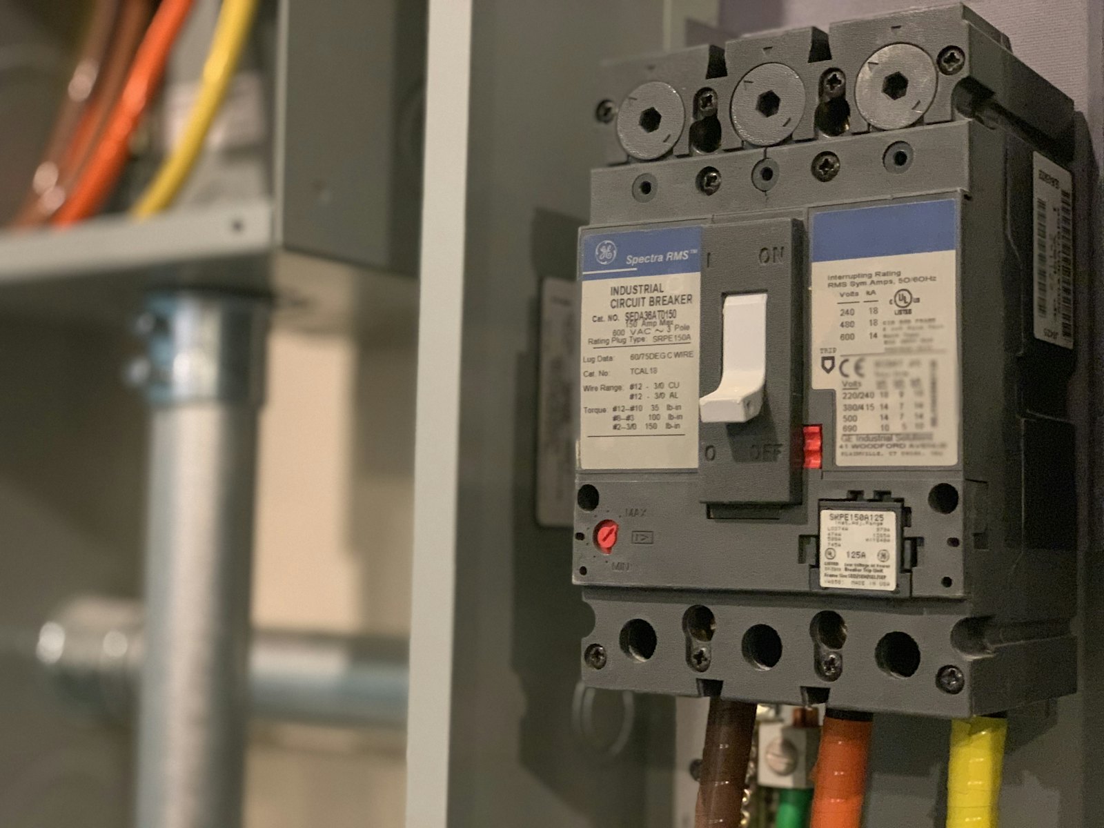 Moulded case circuit breaker inside a grey enclosure